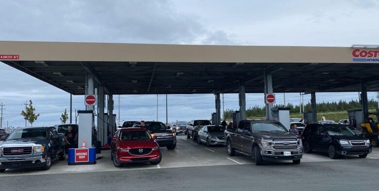 Customers wait in line at the gas pump at Costco in St. John's.