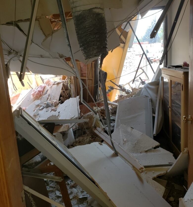 Rubble is seen inside of a heavily damaged office building.