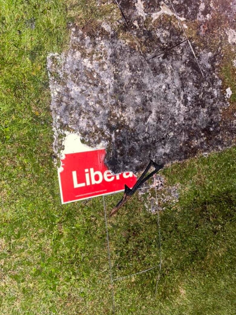 A burned sign with the word 