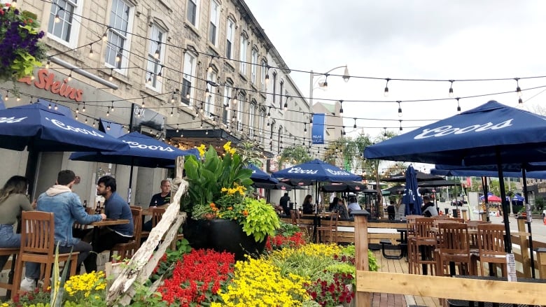 Guelph residents dine at an outdoor patio.