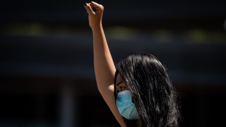 A woman holding her fist up