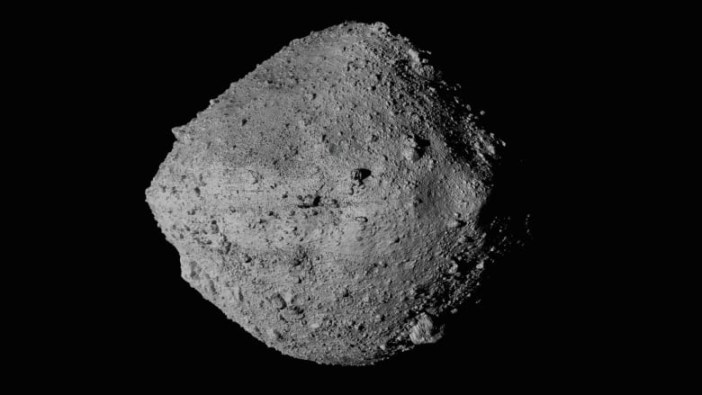 This image shows a rocky walnut-shaped asteroid named Bennu.