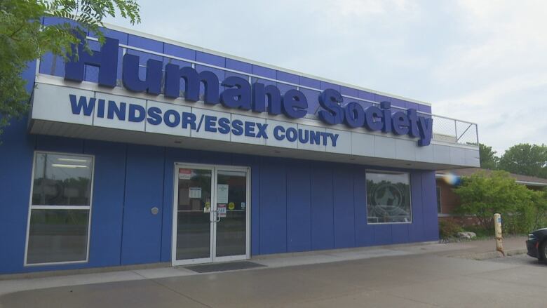 A blue building with a big sign that says Humane Society Windsor/Essex County.