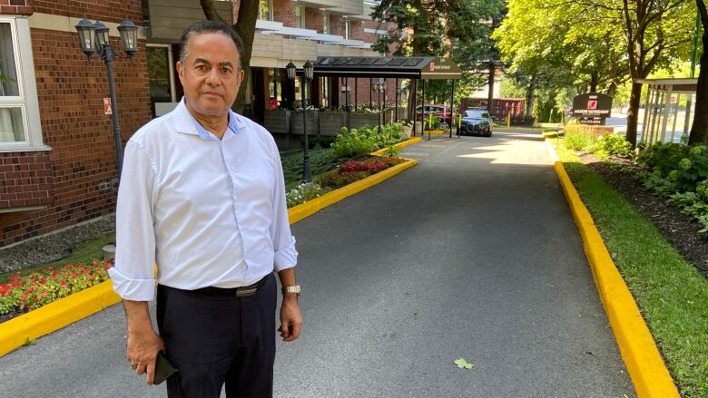 Man stands in driveway