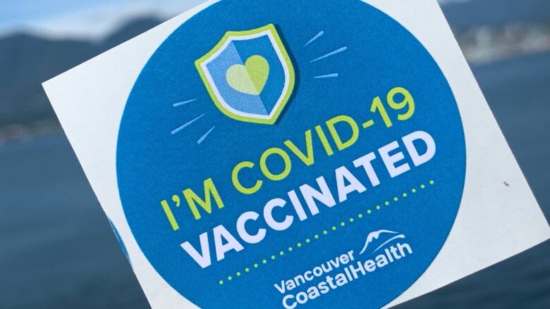 A sticker reading 'I'm COVID-19 Vaccinated' with a symbol of Vancouver Coastal Health below it.