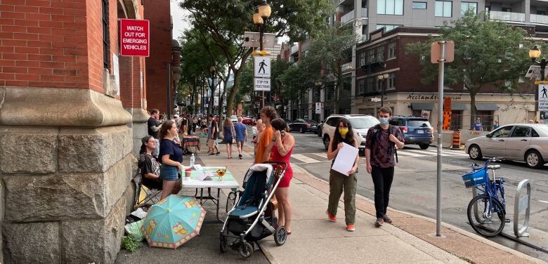 People on a street for Art Crawl in Hamilton. 