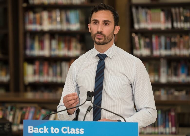 Ontario Education Minister Stephen Lecce speaks at a news conference at St. Robert Catholic High School in Toronto, on August 4, 2021. 