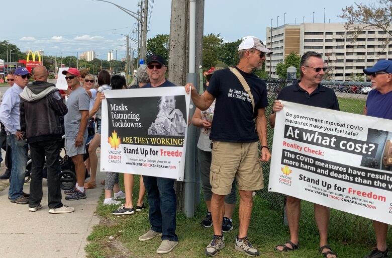 Protesters stood outside of Victoria Hospital in London to protest the vaccine mandate on Monday.