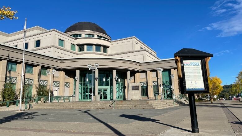 The Prince George courthouse building, with light green accents around the stonework.