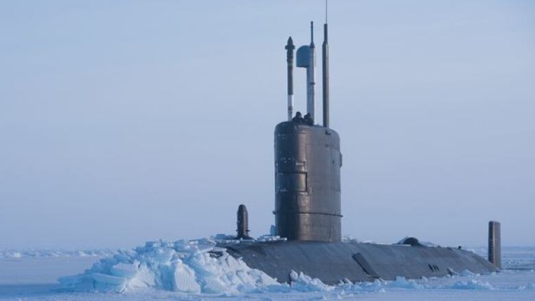 A submarine breaks through Arctic ice.