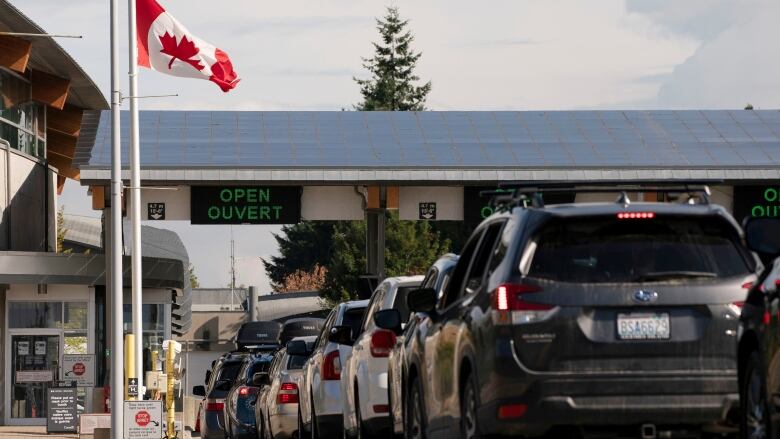 People cross the U.S.-Canadian border after Canada opened the border to vaccinated Americans in Blaine, Washington, U.S., on Aug. 9, 2021.