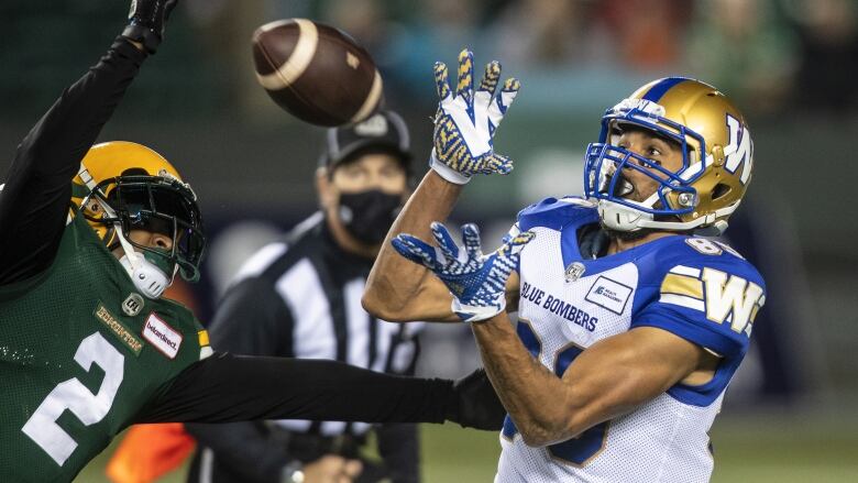 Player catches a football during a game.