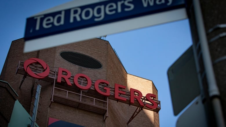 The Toronto head offices of Rogers Communications are pictured on March 15, 2021, with a sign for 