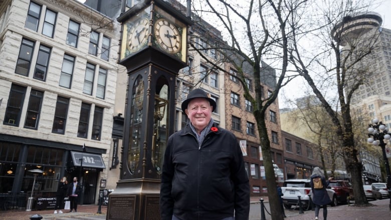 Raymond Saunders stands by the Gastown Steam Clock.