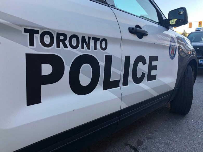 A closeup of the doors on a Toronto police cruiser.