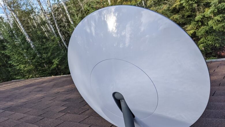 A satellite dish on a roof.