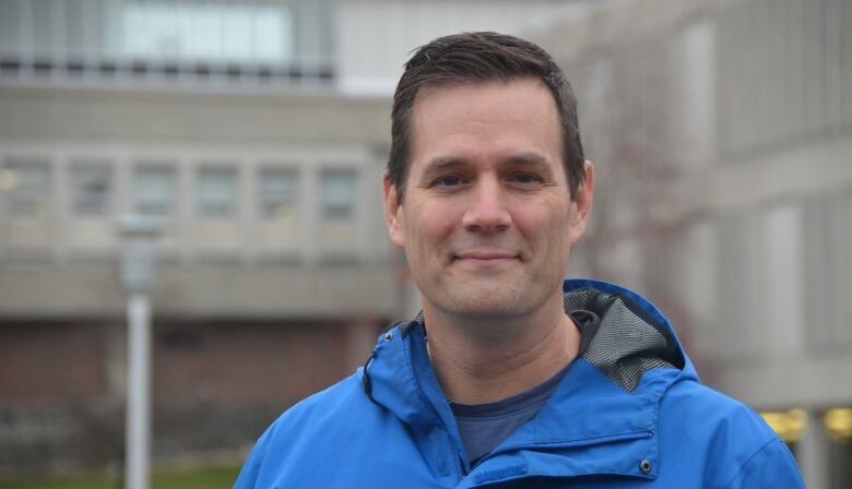 A man wearing a blue jacket.