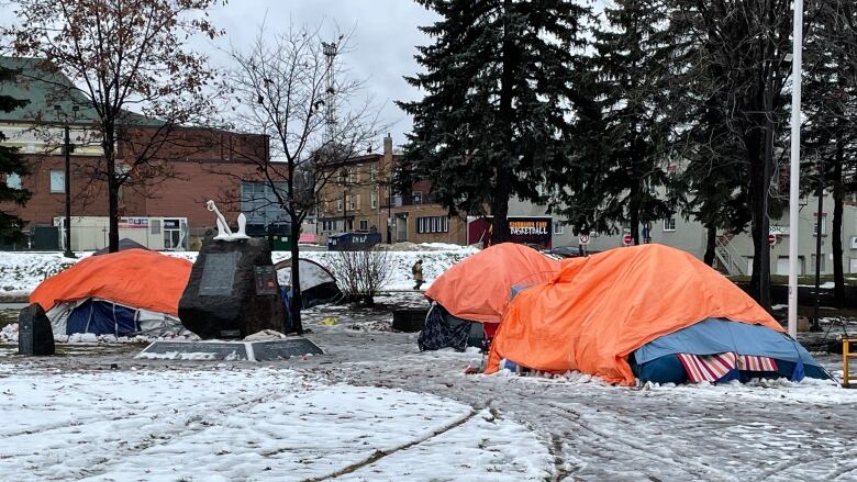 Pictures of tents in a downtown park.