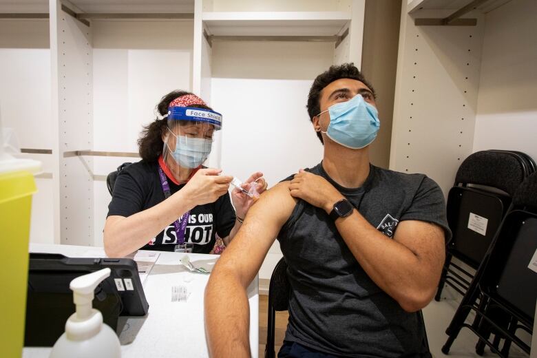 A person being vaccinated.