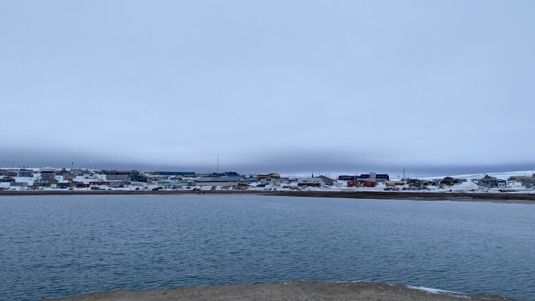 Houses over water, snow.