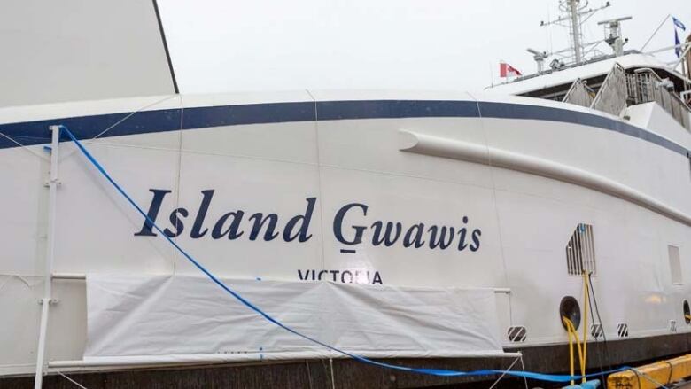 A side profile of the Island Gwawis vessel.