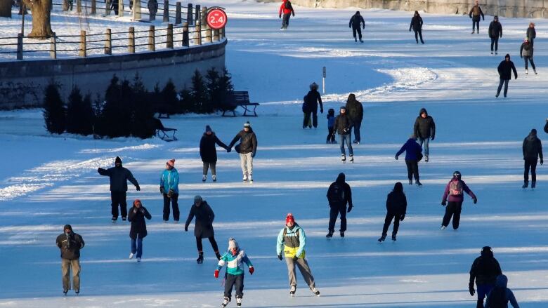 People skate on the Rideau Canal.