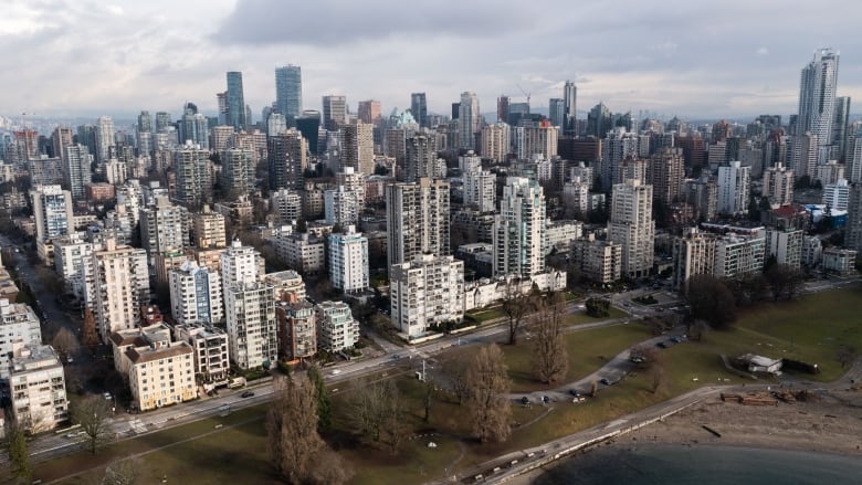 An aerial shot of a number of condo buildings near the water in Vancouver.