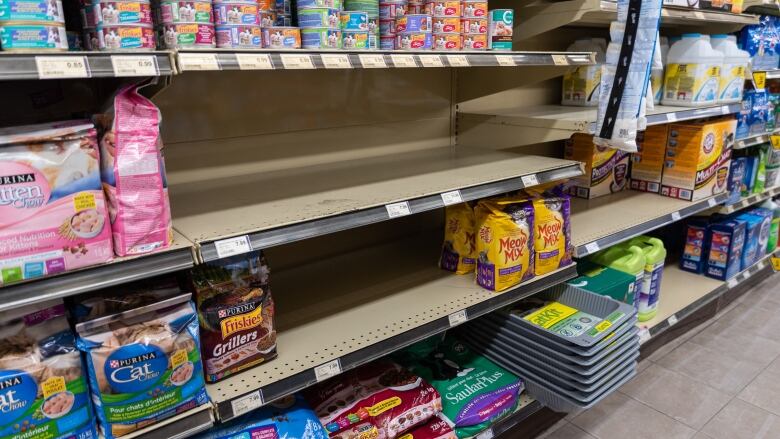 Grocery shelves with bare patches