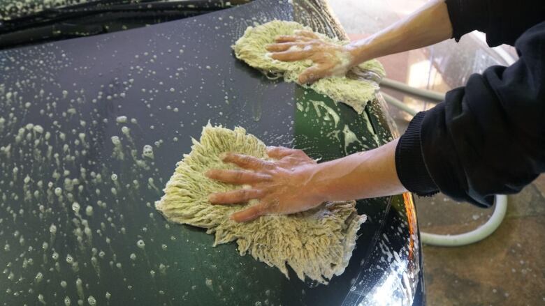 Person washing car.