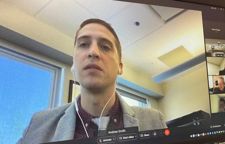 Andrew Smith speaks during a virtual meeting.