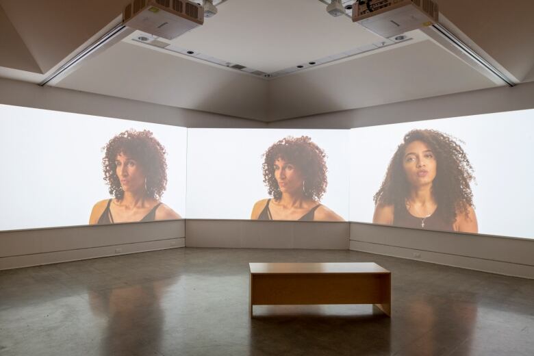 Large video images of two Black women on a screen.