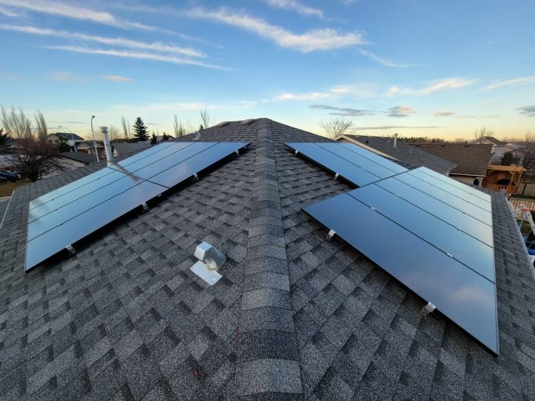 Solar panels on a roof at sunset 