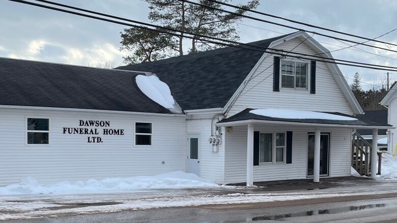 Dawson Funeral Home, with snow on roof.