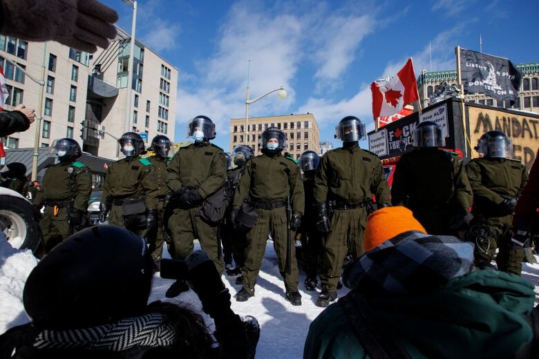 Police from across the country enforce an injunction against protesters camped near Parliament Hill, in Ottawa, on Feb. 18, 2022.