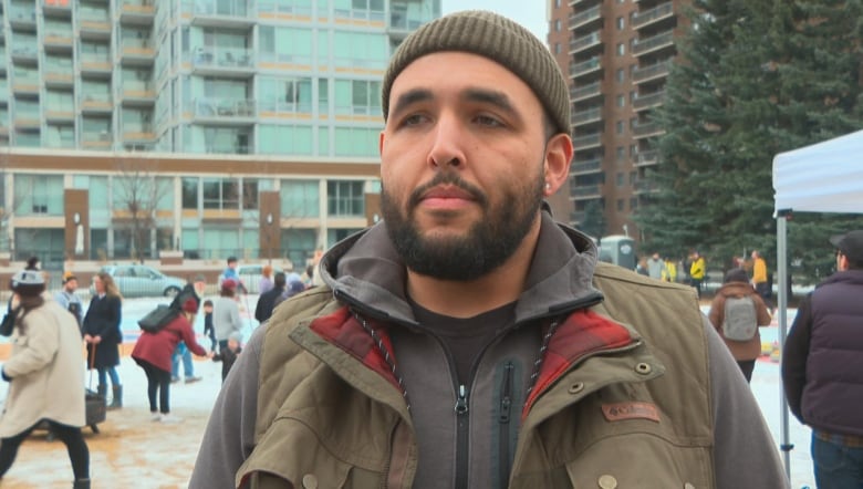 A man stands outside in Calgary.