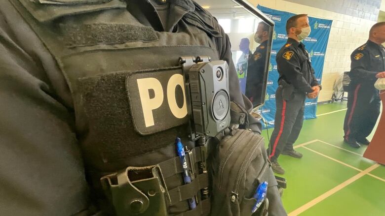 Close up image of a police officer's uniform with a camera mounted at chest level.