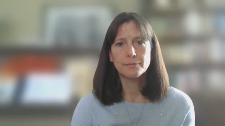 Jill Wood during a zoom interview with a blurred background.