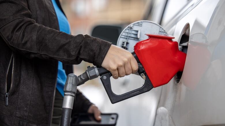 A gas pump in a car.