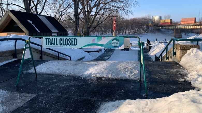 A sign indicates a trail is closed.