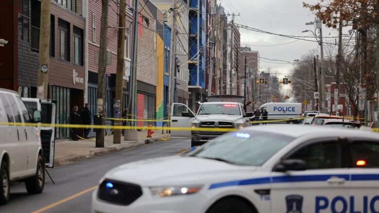 Police cars and caution tape on a Halifax street.