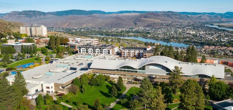 An aerial image shows a university campus. 