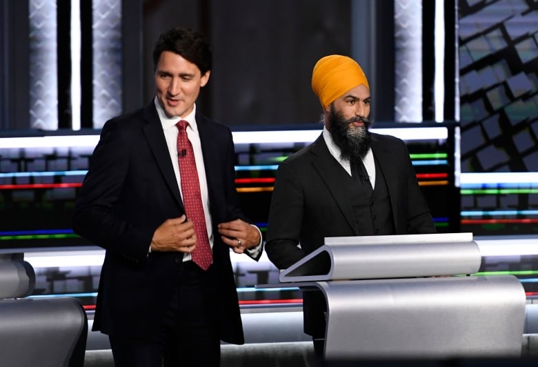 Liberal Leader Justin Trudeau, left, and NDP Leader Jagmeet Singh, prepare for the start of the federal election English-language Leaders debate in Gatineau, Que., on Thursday, Sept. 9, 2021.