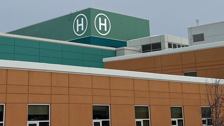 A hospital building exterior on a grey winter day