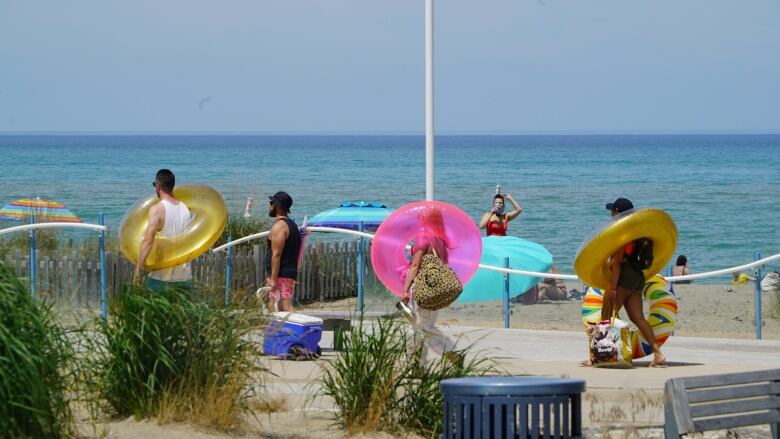 Beach bums soak up the sun at the Grand Bend main beach in June. 