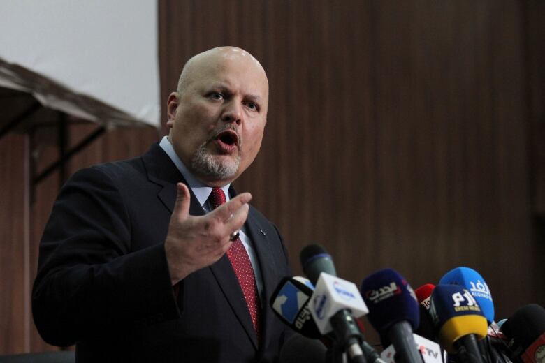 Karim Ahmed Khan, International Criminal Court chief prosecutor, speaks during a news conference at the Ministry of Justice in the Khartoum, Sudan on Aug. 12, 2021.