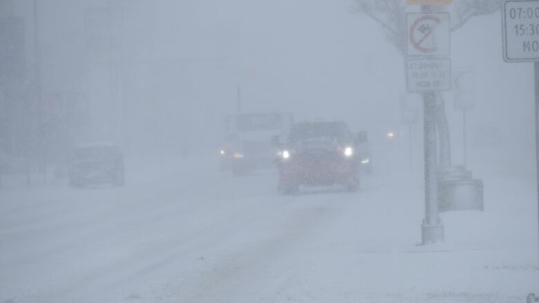 Cars under heavy snow