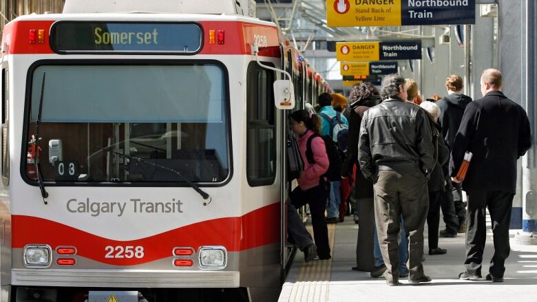 Passengers board a Calgary Ctrain.