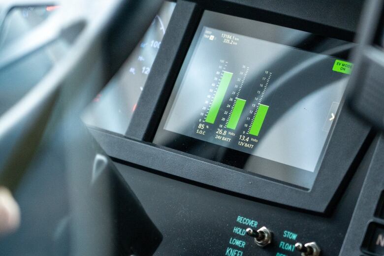 A photo of a bus driver's dashboard with in an OC Transpo electric bus in Ottawa.