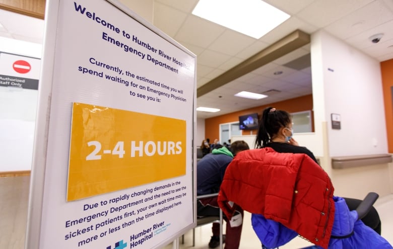 A sign, indicating the estimated wait time at Humber River Hospital, is pictured in the emergency department in Toronto on April 26. The hospital is facing higher patient volumes, and a rise in flu cases.