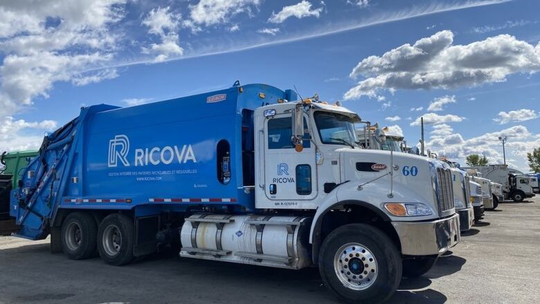 A blue Ricova waste removal truck